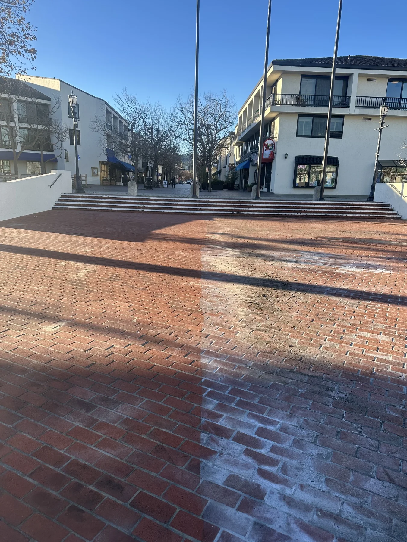 Brick plaza during pressure washing