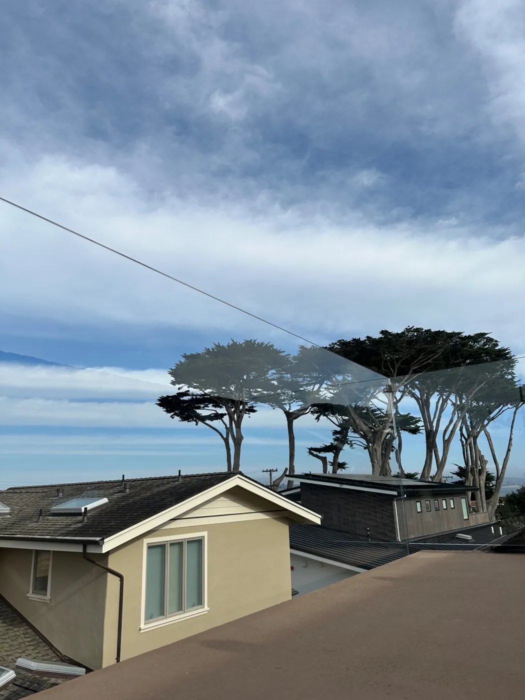 Residential roof and property overlooking the coast